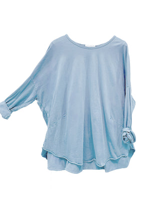 Light blue blouse with ruffled sleeves on a white background