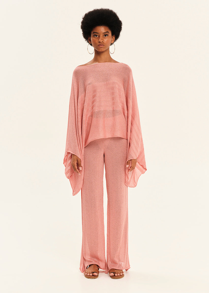 Woman wearing a pink outfit on a white background