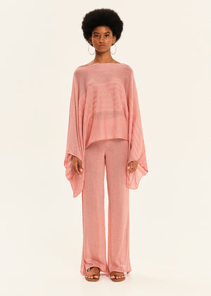 Woman wearing a pink outfit on a white background