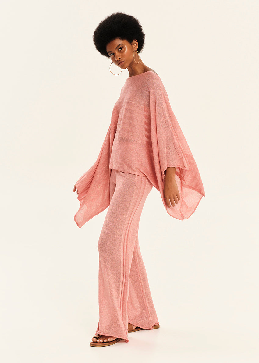 Woman wearing a pink outfit on a white background