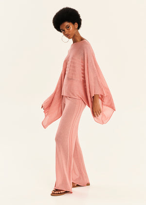 Woman wearing a pink outfit on a white background