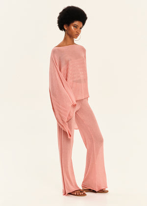 Woman wearing a pink outfit on a white background