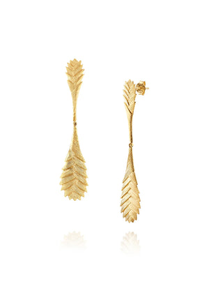 Gold leaf-shaped earrings on a white background