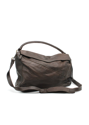 Brown leather handbag with a shoulder strap on a white background
