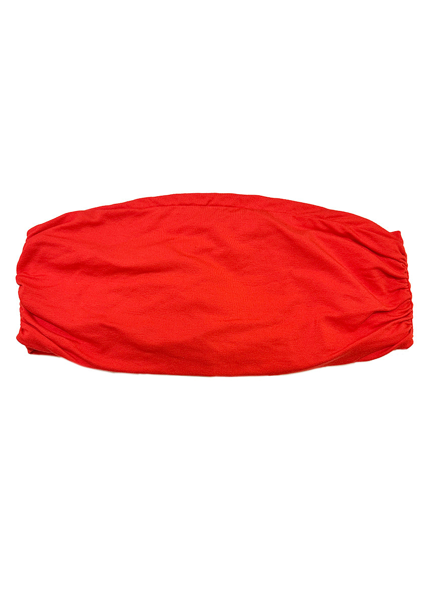 A red bustier top on a white background 