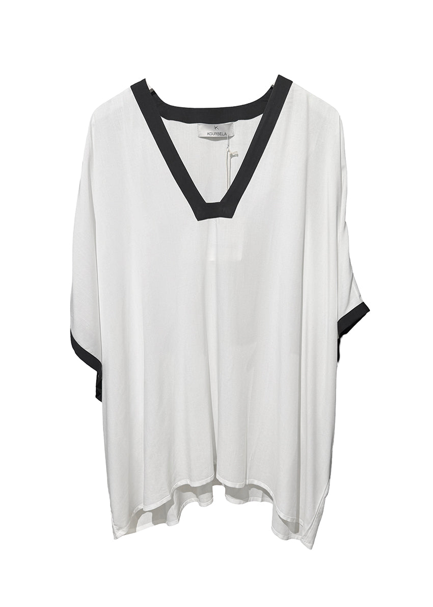 White blouse with black accents on a white background