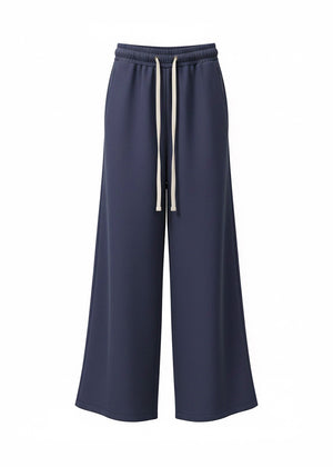 Navy blue wide-leg pants with a drawstring on a white background