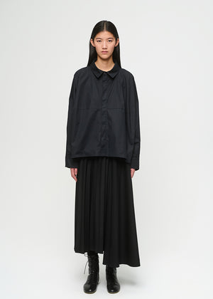 Person wearing a black outfit on a white background