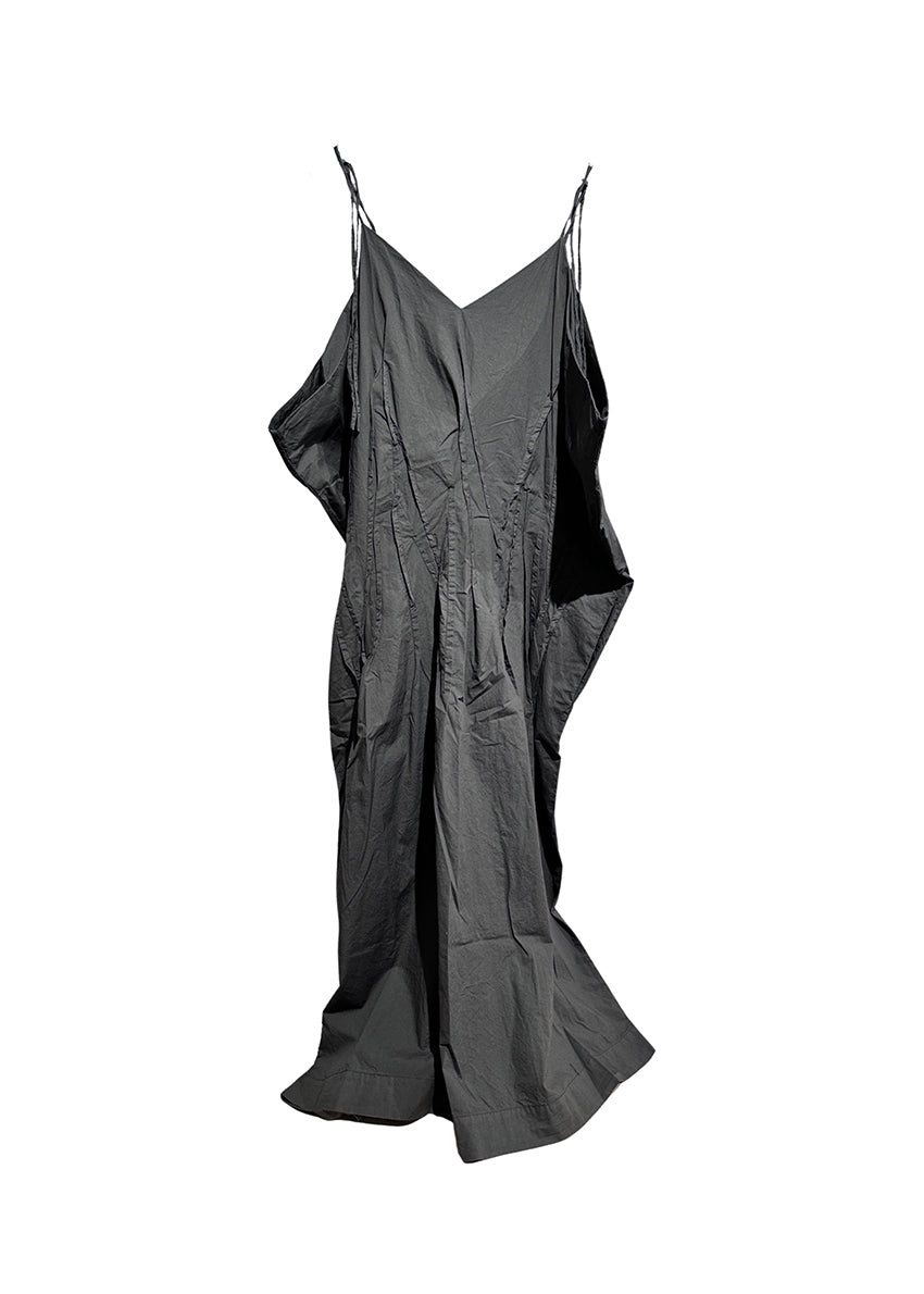Long dress with thin straps, cut for a relaxed fit, made of soft cotton poplin. CASO features a V neck both in the front and back, open low armholes creating draping on the sides, and decorative nervirs on the front side.