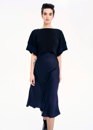 Knit short – sleeved crop top made of 100% Greek cotton in a loose fit. It features a design with details of stripes.