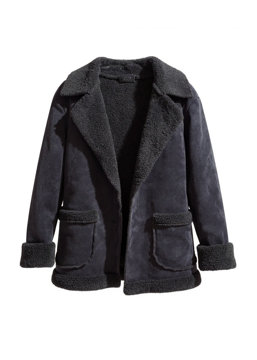 Black shearling short coat. Featuring a plush faux-shearling lining, cozy collar, and practical front pockets.