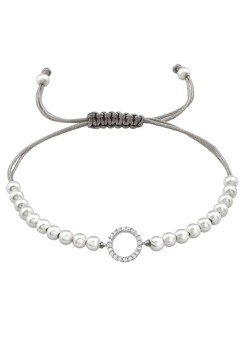 Adjustable corded bracelet with silver plating and cubic zirconia beads, with a loop closure.