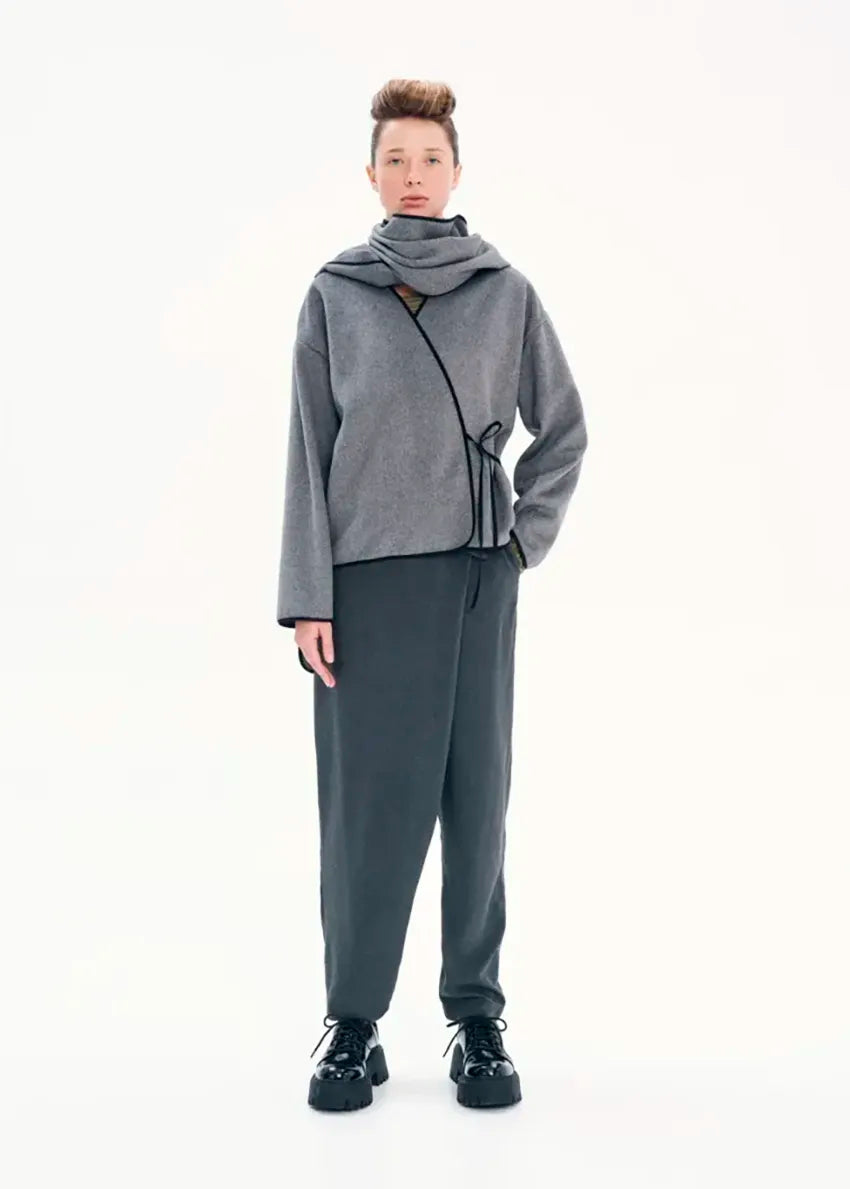Short wrap grey coat made of furry wool that ties at the side and has a detachable scarf.A winter must – have coat that can be worn from morning to night.
