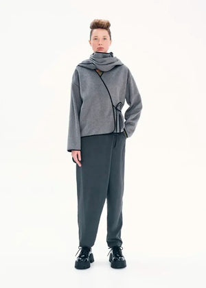 Short wrap grey coat made of furry wool that ties at the side and has a detachable scarf.A winter must – have coat that can be worn from morning to night.
