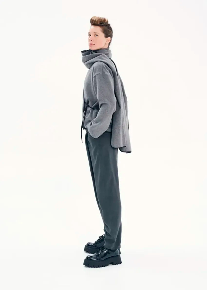 Short wrap grey coat made of furry wool that ties at the side and has a detachable scarf.A winter must – have coat that can be worn from morning to night.