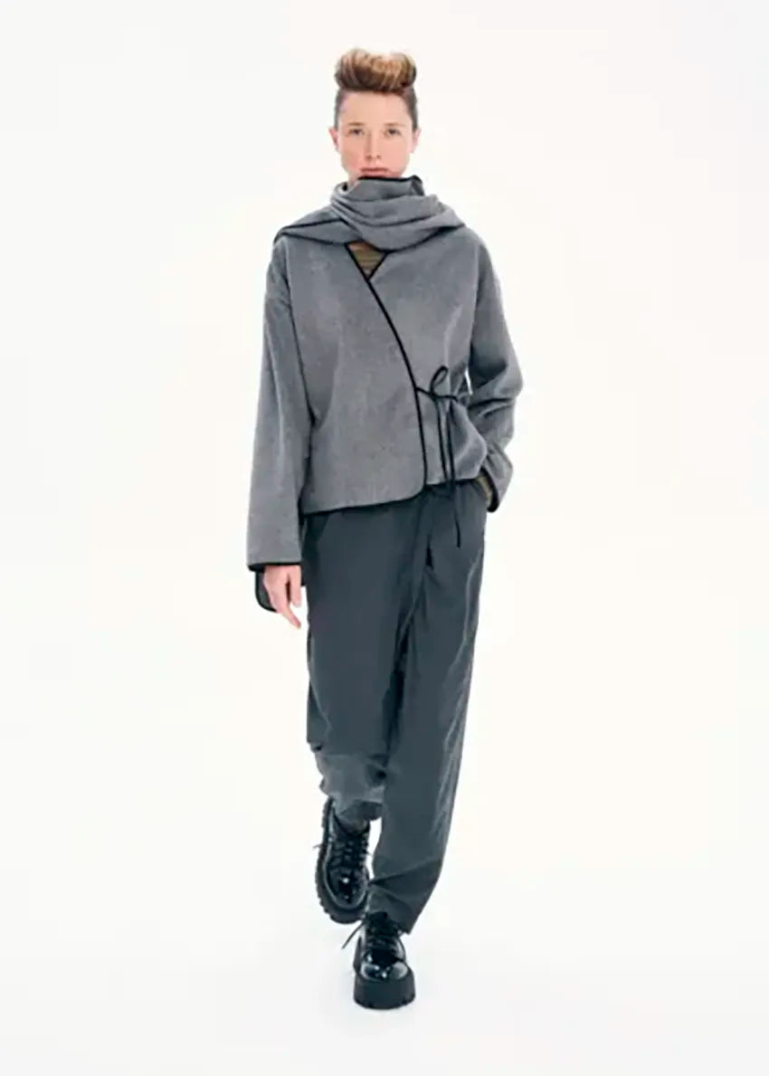 Short wrap grey coat made of furry wool that ties at the side and has a detachable scarf.A winter must – have coat that can be worn from morning to night.