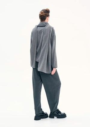 Short wrap grey coat made of furry wool that ties at the side and has a detachable scarf.A winter must – have coat that can be worn from morning to night.