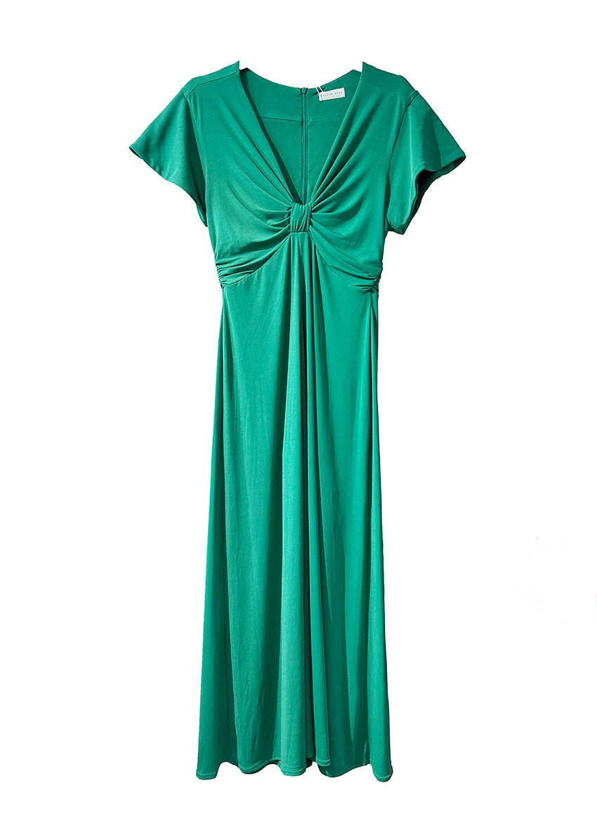 The long knotted green dress with a V-neckline is a sophisticated and stylish garment. The dress features a knotted detail at the waist