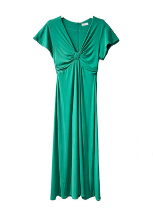 The long knotted green dress with a V-neckline is a sophisticated and stylish garment. The dress features a knotted detail at the waist