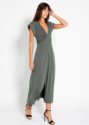 The long knotted grey dress with a V-neckline is a sophisticated and stylish garment. The dress features a knotted detail at the waist