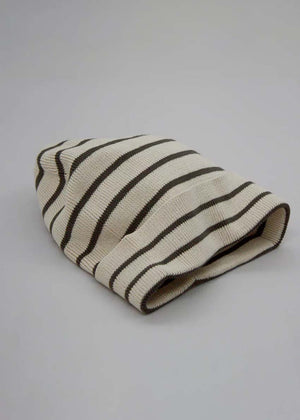 A striped cotton beanie hat with black and white colors.