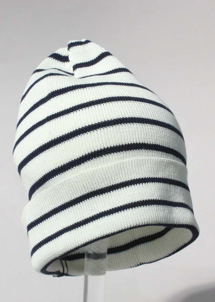 A striped cotton beanie hat with black and white colors.