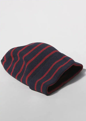 A striped cotton beanie hat with red and black colors.