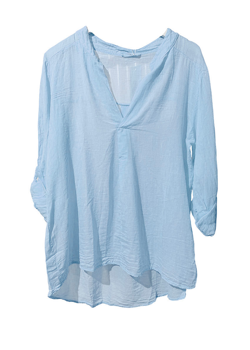 Light blue blouse on a white background
