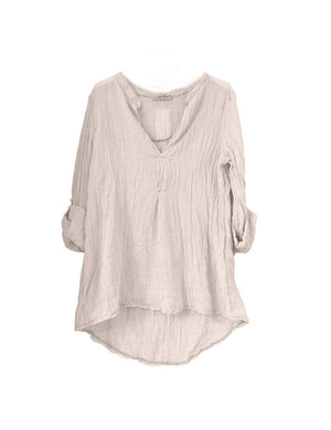 A beige shirt on a white background 