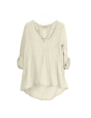 A beige shirt on a white background 