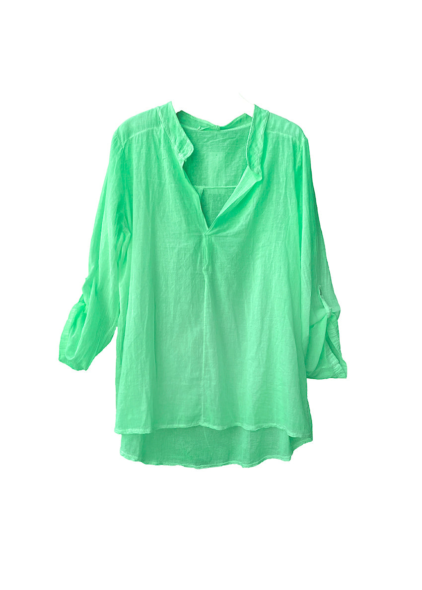 A medium spring green shirt on a white background 