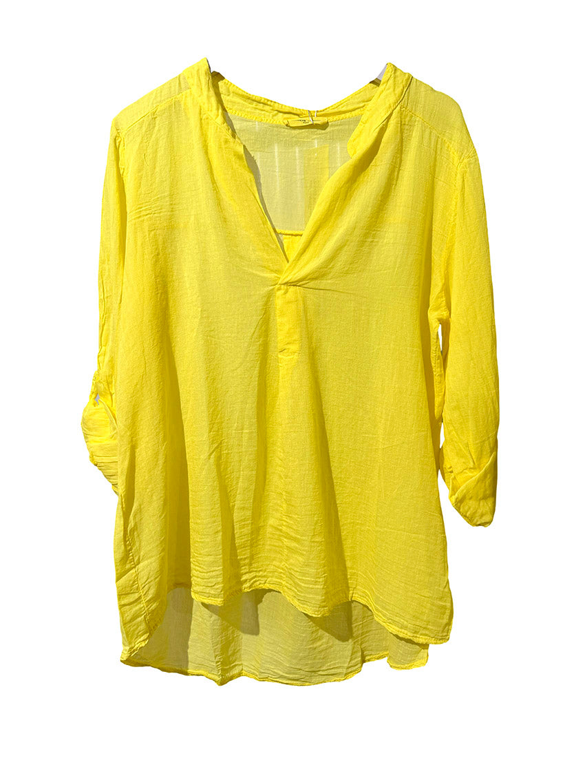 A yellow shirt on a white background 