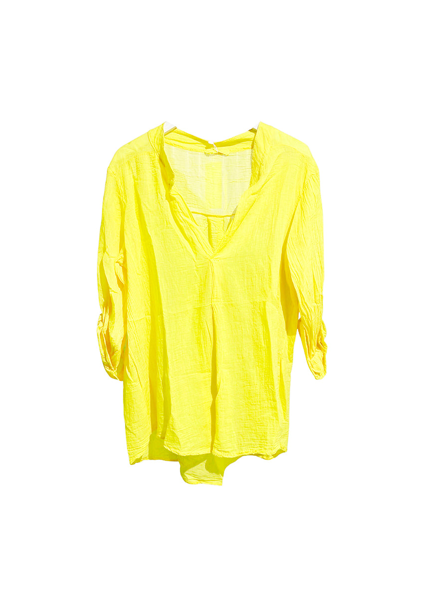 A yellow shirt on a white background 