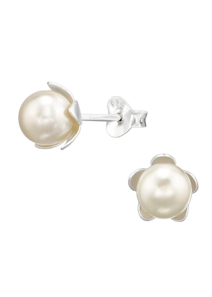A pair of silver earrings with black-colored flower-shaped pearls, against a white background.