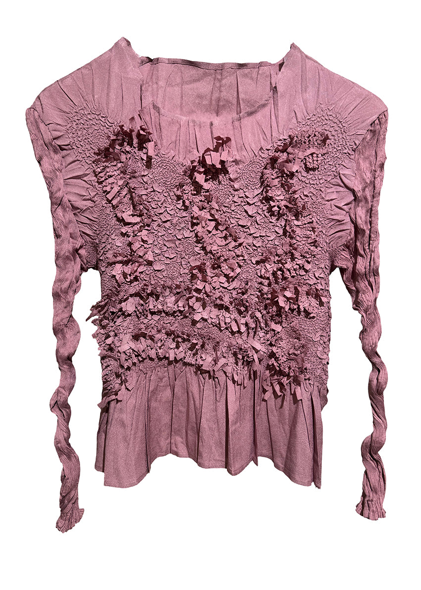 Pink textured top with long sleeves on a white background