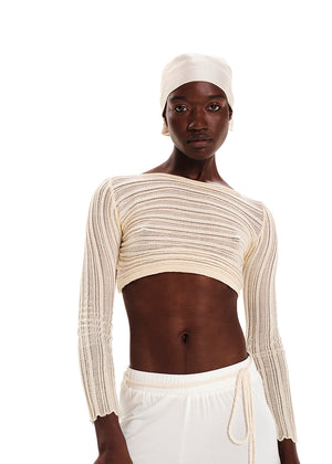 Knitted long sleeved crop top with the “Archetypes” rib pattern and yarn made of 100% high quality Greek cotton, in a fitted silhouette. It has a boat neckline.