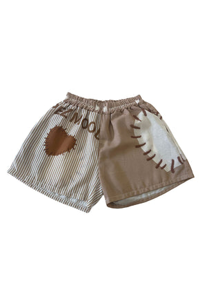 Short pants in a beige color with white stripes and brown heart on a white background 