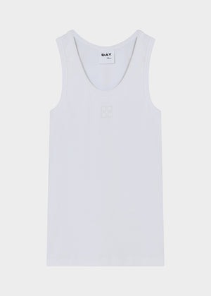 White tank top with 'DAY' branding on a light gray background
