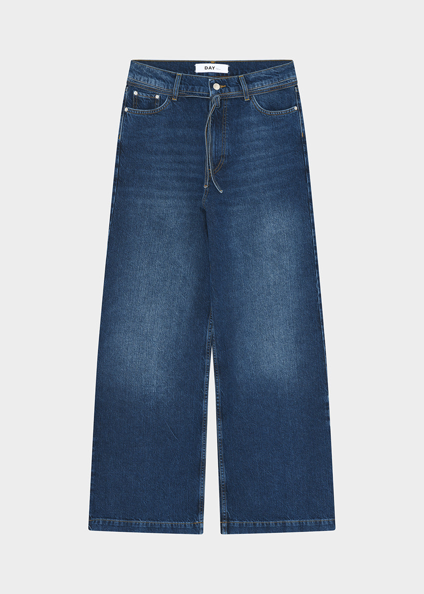 Blue jeans on a light gray background