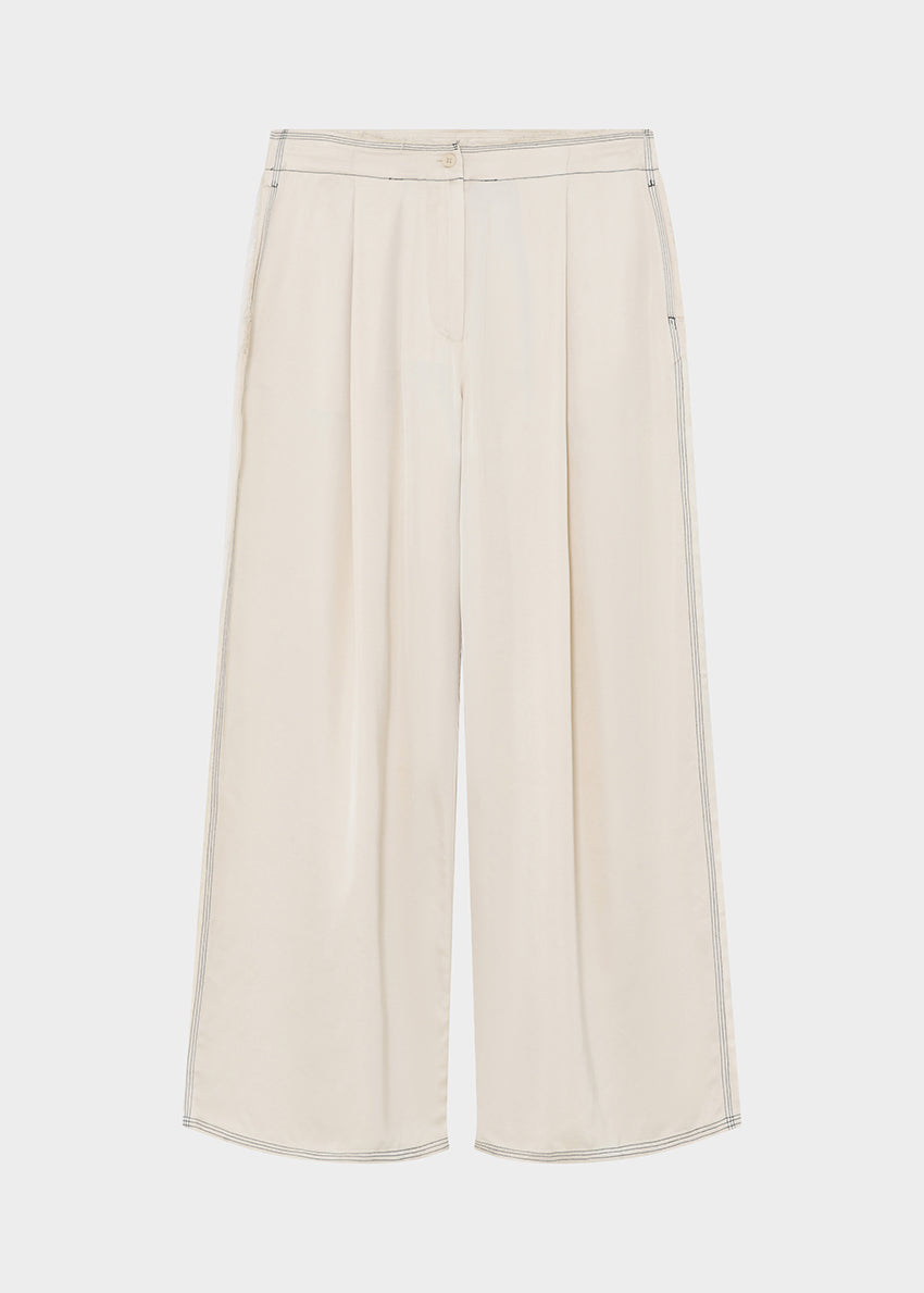 White wide-leg pants on a light gray background