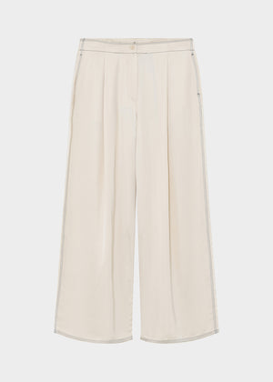 White wide-leg pants on a light gray background