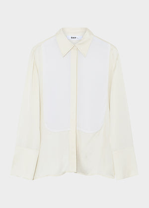 Light-colored shirt with a collar on a white background