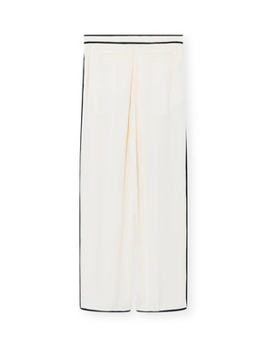 White pants with black trim on a white background