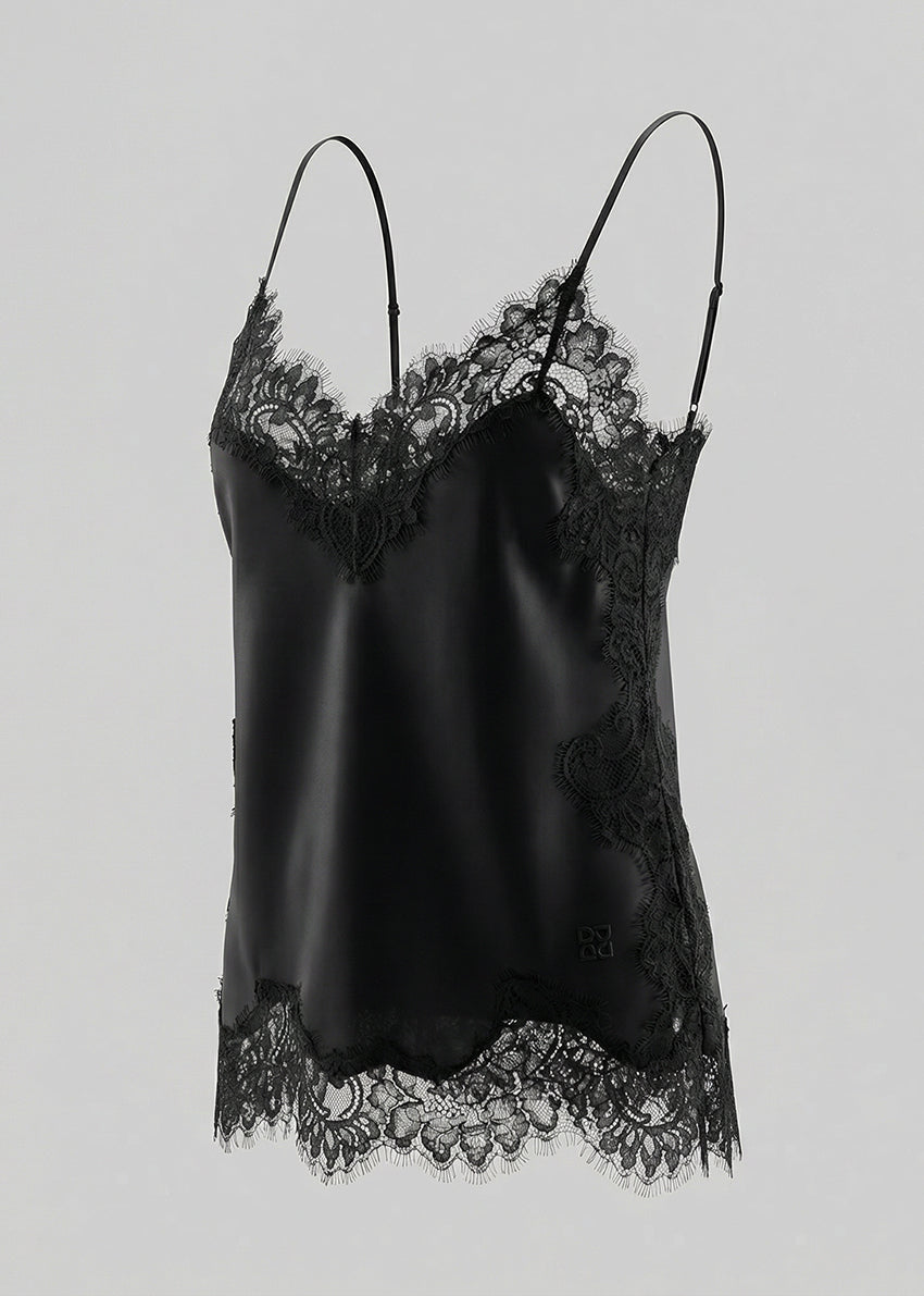 Black lace-trimmed satin camisole on a light gray background