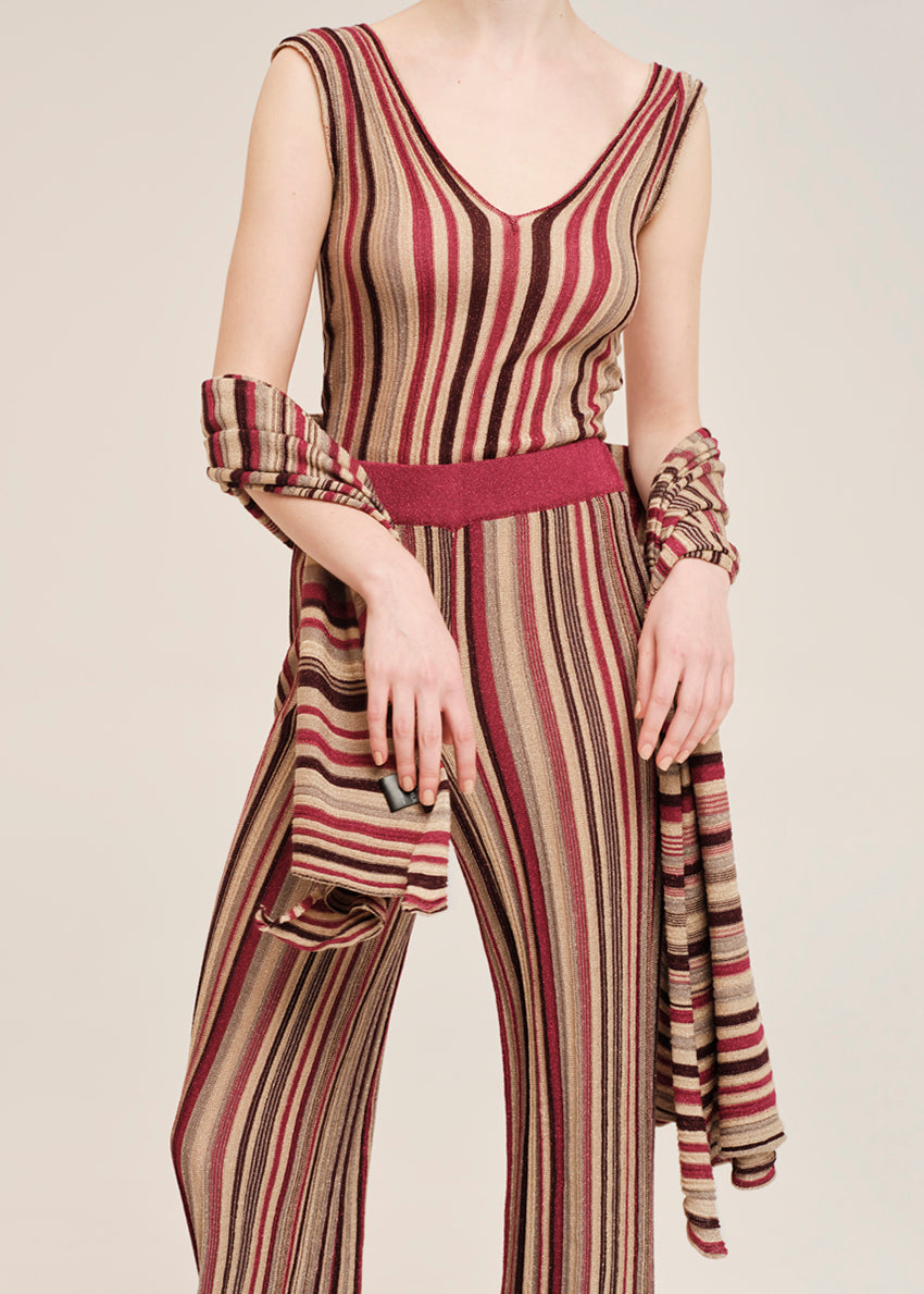 Knit red top crafted from shimmering lurex viscose yarn. Featuring a deep V-neckline, it’s designed with a signature tricolor stripe pattern.