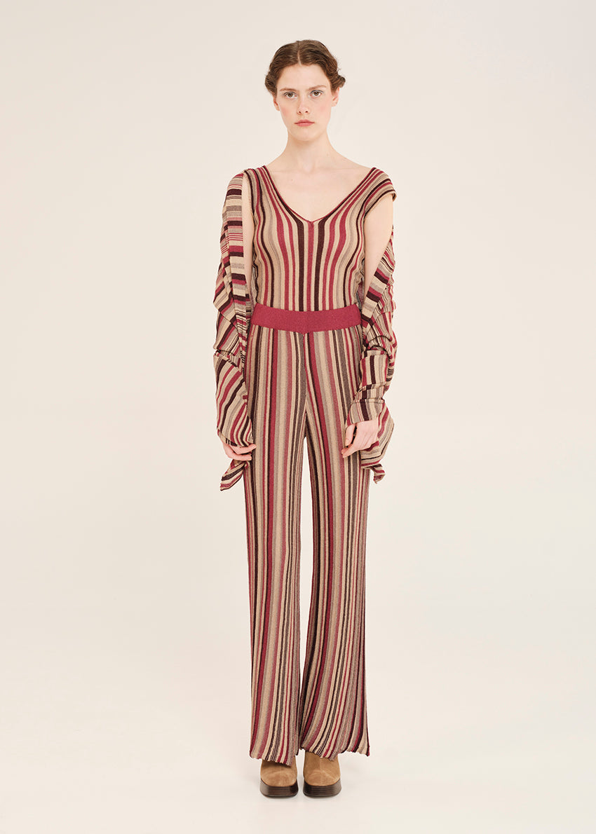 Knit red top crafted from shimmering lurex viscose yarn. Featuring a deep V-neckline, it’s designed with a signature tricolor stripe pattern. Matching pants and cardigan