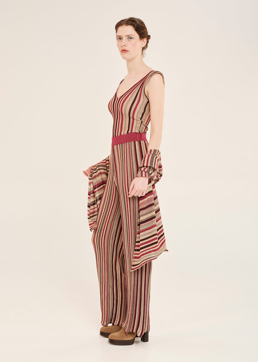 Knit red top crafted from shimmering lurex viscose yarn. Featuring a deep V-neckline, it’s designed with a signature tricolor stripe pattern. Matching pants and cardigan
