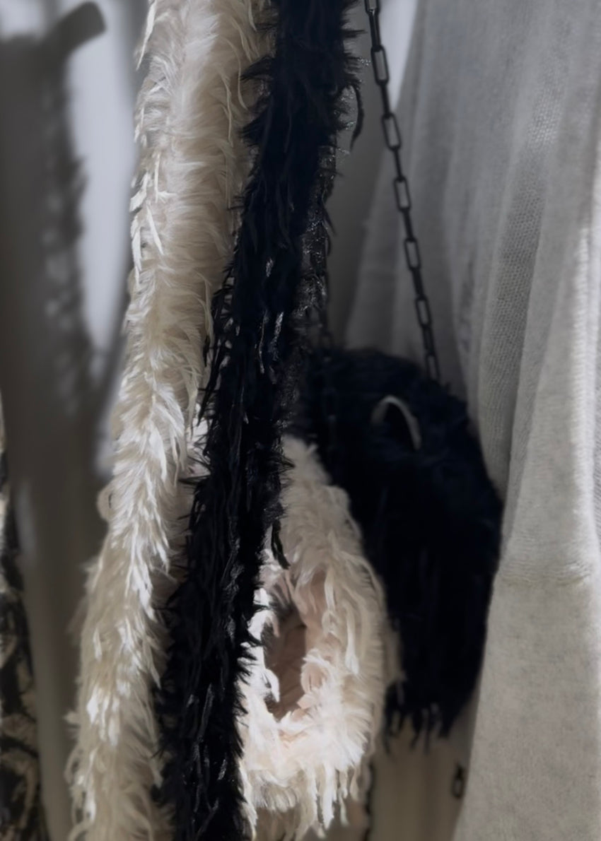 Black and white bags with feathers 