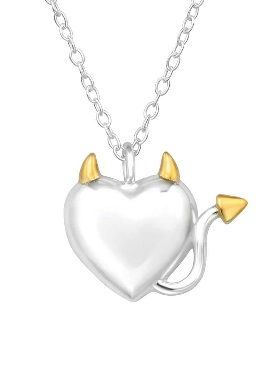 A silver necklace featuring a heart-shaped pendant with two small horn-shaped charms at the top.