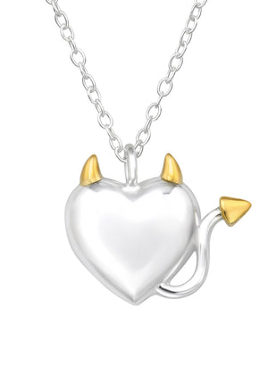 A silver necklace featuring a heart-shaped pendant with two small horn-shaped charms at the top.